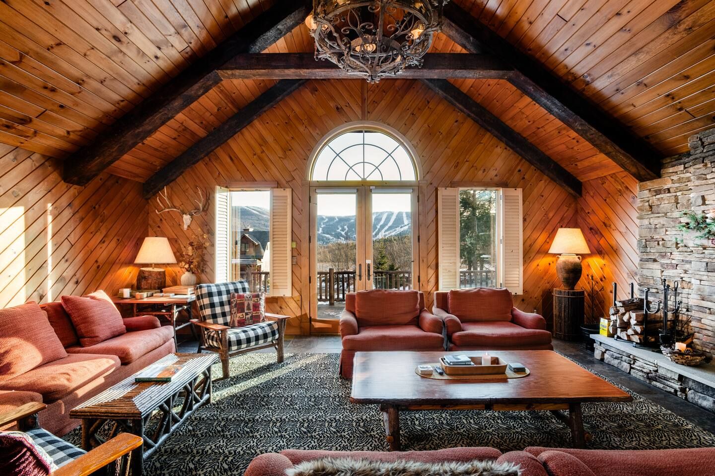 A lodge living room with mountain views
