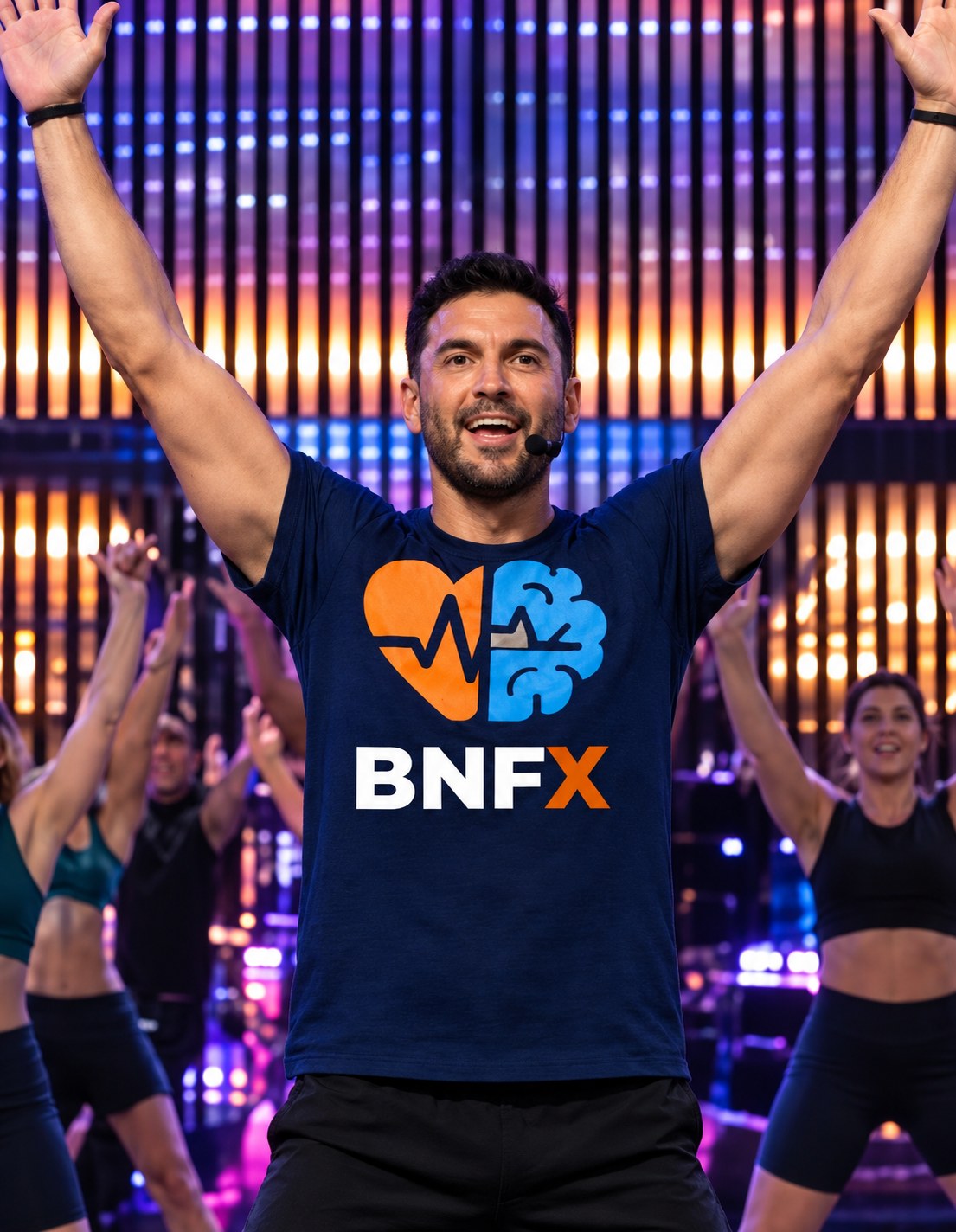 A BNFx coach leading a class with energy, arms raised